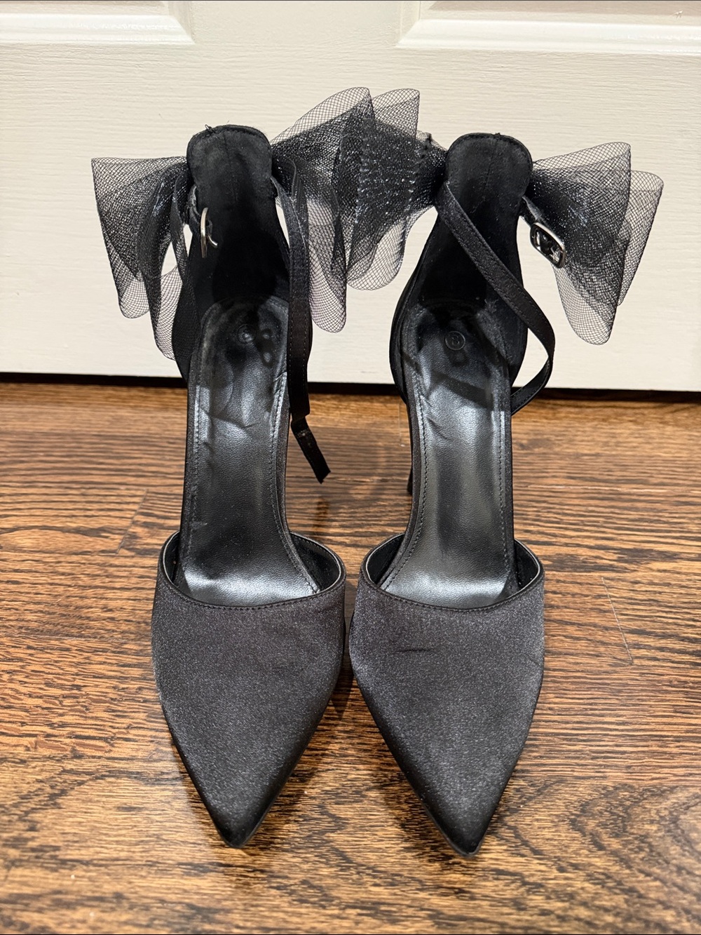 Elegant Black Pointed-Toe Ankle-Strap Heels with Bow Accent